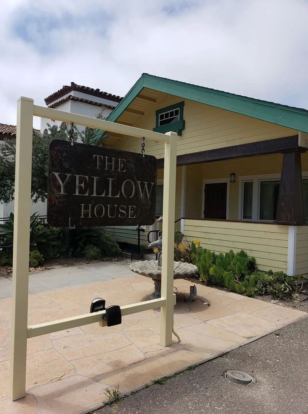 The Yellow House Arts Academy building and sign on Guadalupe Street